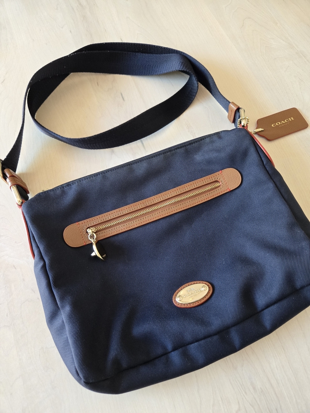 Coach Navy Messenger Bag with Tan Leather Trim and Gold Hardware